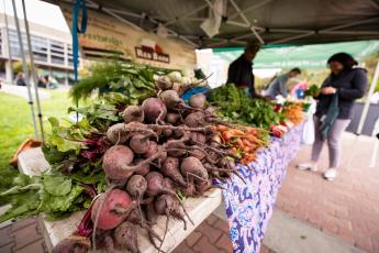 A pile of beets at a farmer's market stand on the Cal Poly campus.