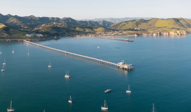 A view of the Cal Poly Pier from the air with boats all around. 