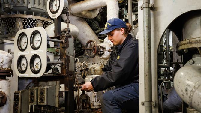 Student works on ship system