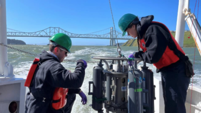 Oceanography students working on a boat in the San Francisco Bay.